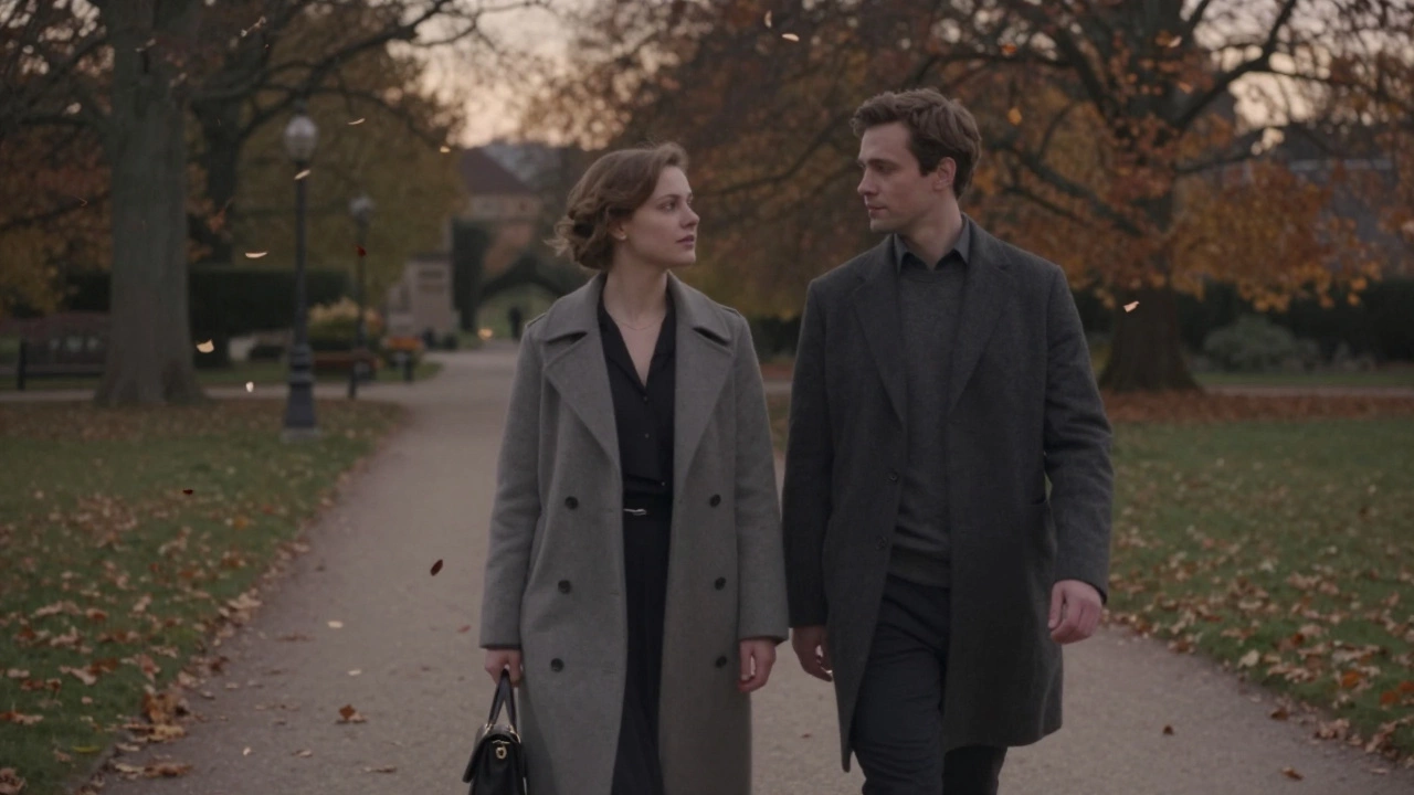Two people walking calmly in Luxembourg Gardens during autumn evening.